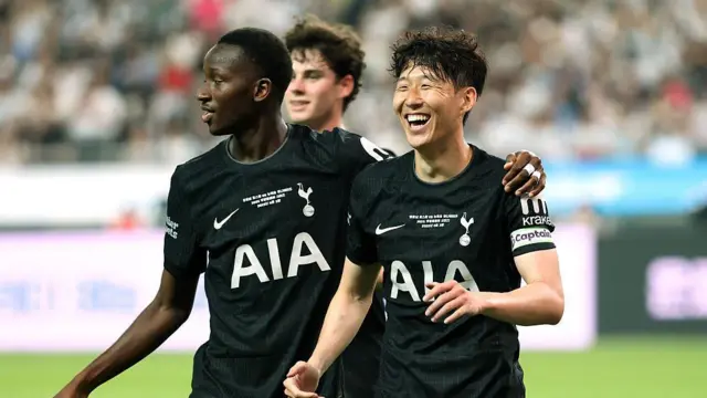 Son Heung-Min and Pape Matar Sarr celebrate their team's first goal scored by Brennan Johnson