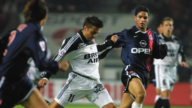 Mikel Arteta chases after the ball during his time with PSG.