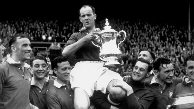 Manchester United captain Johnny Carey with the FA Cup in 1948