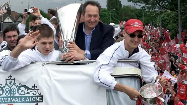 Gerard Houllier, Sami Hyypia and Steven Gerrard hold trophies on a bus parade through Liverpool