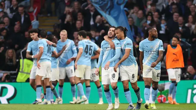 Manchester City's Rayan Cherki and Nathan Ake celebrate 