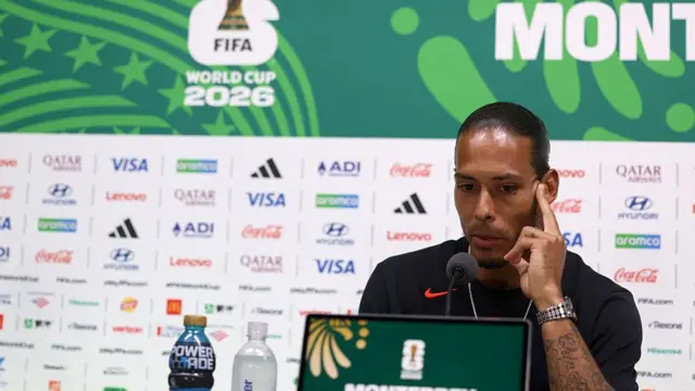 Virgil van Dijk speaks during a press conference