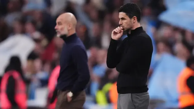 Mikel Arteta looks on