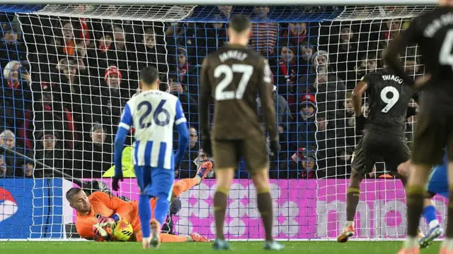 Bart Verbruggen of Brighton saves a penalty from Igor Thiago