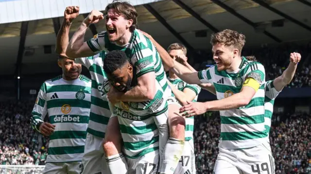 Celtic players celebrate at Hampden