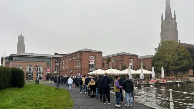 Aston Villa fans queue for tickets in Bruge