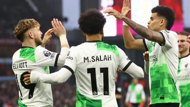 Liverpool players celebrate a goal