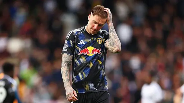 Joe Rodon of Leeds United looks dejected 