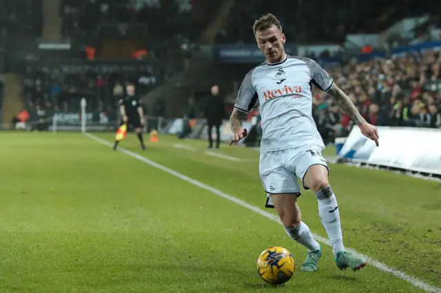 Swansea City's Josh Tymon controls the ball during a match