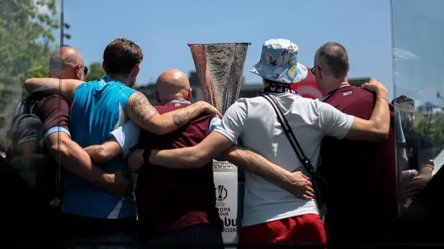 Aston Villa fans pose for a photograph