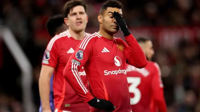 Casemiro puts his hand on his head