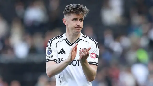 Fulham's Tom Cairney applauds the fans 