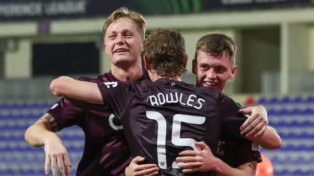 Frankie Kent (left) celebrates Hearts' first goal of the game