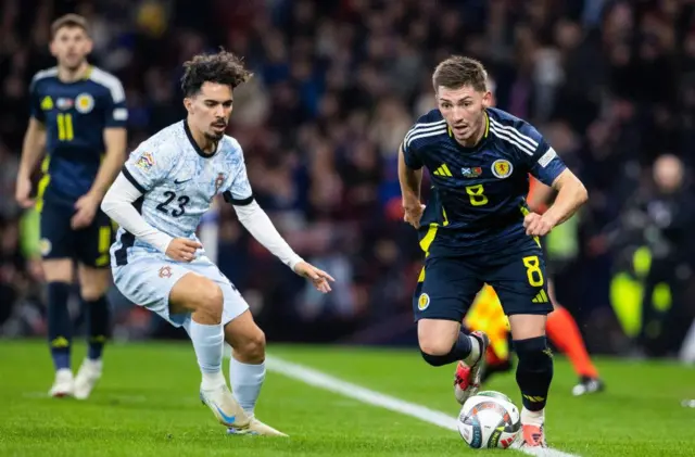 GLASGOW, SCOTLAND - OCTOBER 15: Scotland's Billy Gilmour (R) and Portugal's Vitinha in action during a UEFA Nations League Group A1 match between Scotland and Portugal at Hampden Park, on October, 15, 2024, in Glasgow, Scotland. (Photo by Alan Harvey / SNS Group)