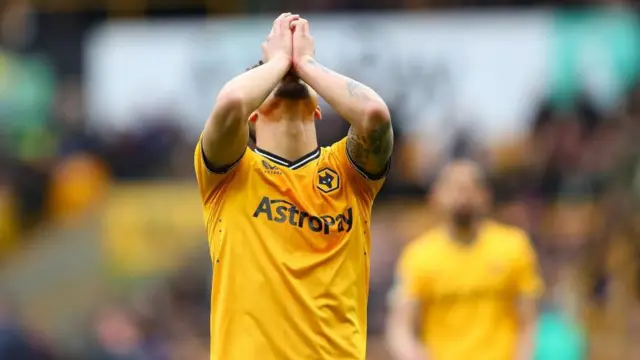 Joao Gomes of Wolves reacts after missing a shot at goal