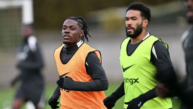 Romeo Lavia running in training alongside Reece James