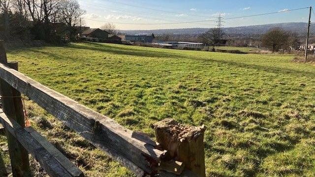 A fence and field at Earls farm, Harwood, in Bolton.