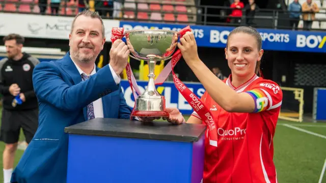 Kelsie Burrows with League Cup trophy