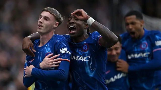Cole Palmer and Noni Madueke celebrate a goal against Liverpool