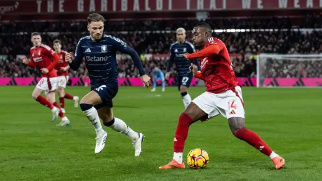 Nottingham Forest's Callum Hudson-Odoi (right) competing with Aston Villa's Matty Cash during the Premier League match between Nottingham Forest FC and Aston Villa FC at City Ground