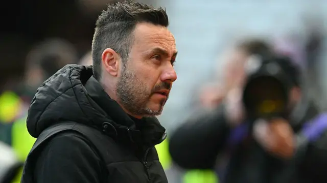 Tottenham Hotspur's Italian head coach Roberto De Zerbi looks on