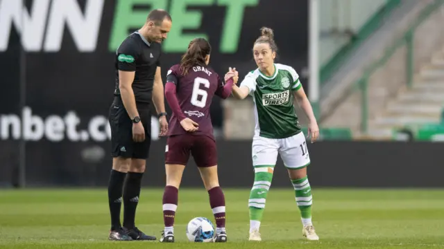 Hibernian captain Joelle Murray and Hearts captain Ciara Grant during a Scottish Women's Premier League match between Hibernian and Heart of Midlothian at Easter Road