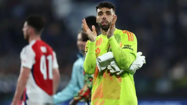 David Raya applauds after match