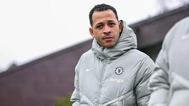 Liam Rosenior in Chelsea's training kit looking across the pitch at the training ground