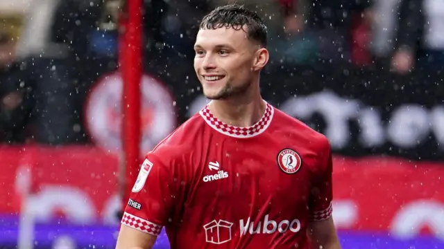 Luke McNally celebrates after scoring a goal for Bristol City