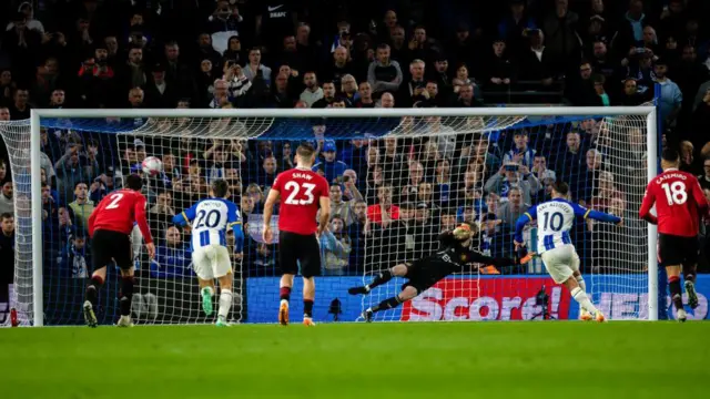 Alexis MacAllister of Brighton scores a penalty.