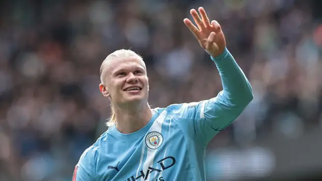 Erling Haaland of Manchester City celebrates his hat-trick.