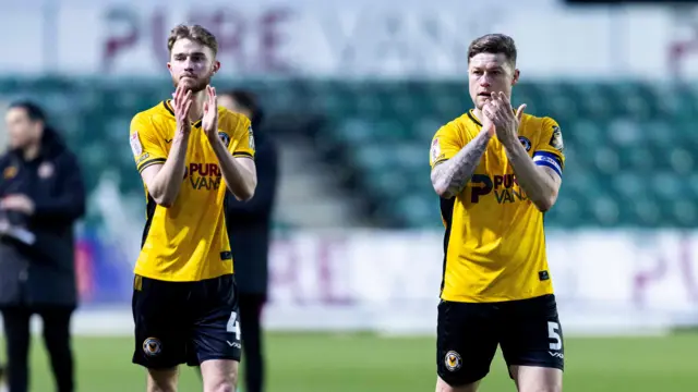 Newport's Matt Baker and James Clarke clap the fans after their win over Barrow 