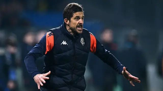 Alessio Dionisi pictured on the sidelines coaching Empoli in a dark blue training top