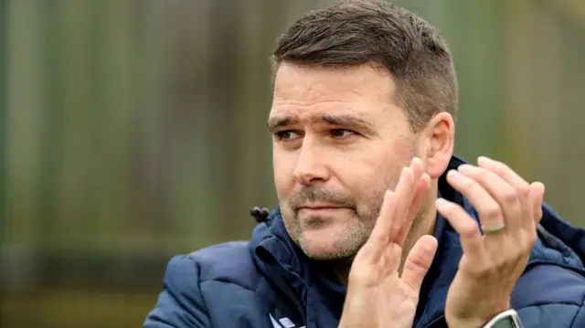 David Healy applauds Linfield's supporters at Taylors Avenue