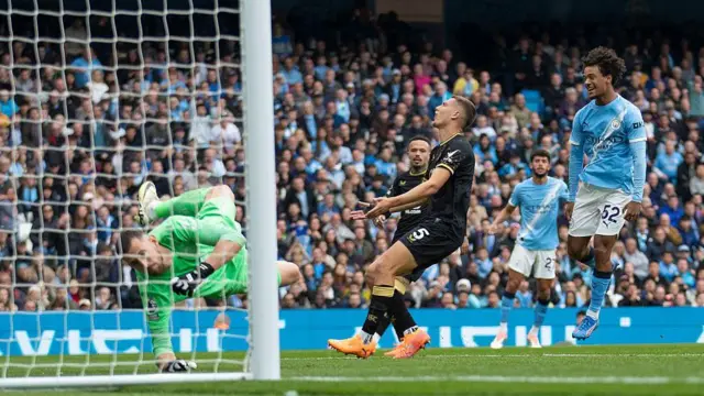 Burnley goalkeeper Martin Dubravka concedes a goal from Oscar Bobb