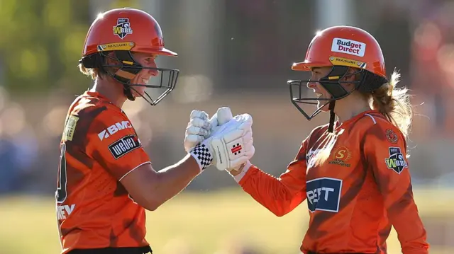 Beth Mooney and Katie Mack shake hands while batting for Perth Scorchers in their knockout match against Melbourne Stars