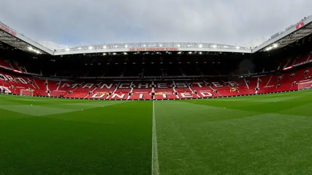 Three sides of Manchester United's Old Trafford stadium when empty