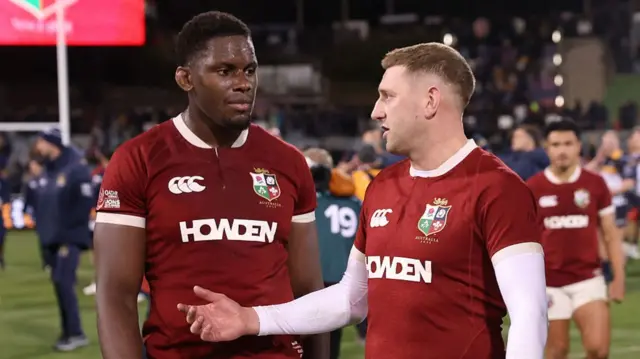 Maro Itoje and Finn Russell chat after the end of the match