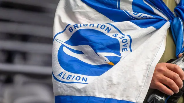 General view of fan wearing Brighton flag