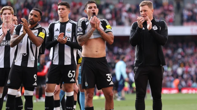 Eddie Howe and his Newcastle players salute their travelling fans after a 1-0 defeat at Arsenal