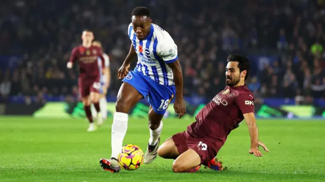 Danny Welbeck dribbles past Ilkay Gundogan