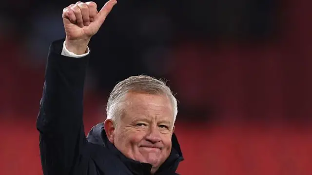 Sheffield United boss Chris Wilder salutes the travelling Blades fans at Stoke