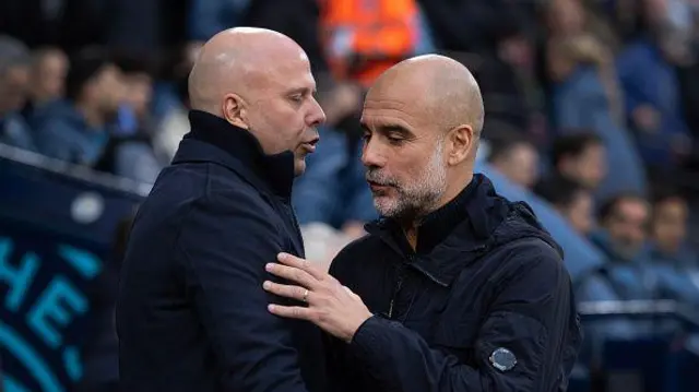 Pep Guardiola and Arne Slot