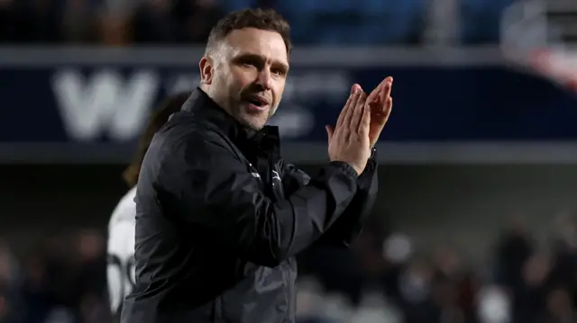 Derby manager John Eustace applauds the Rams fans