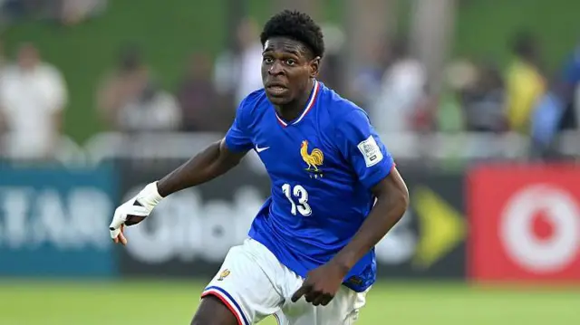 Emmanuel Mbemba running while playing for France's youth team