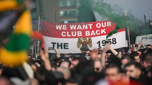 Manchester United fans protest ahead of the home game against Arsenal in March