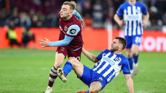 Jarrod Bowen of West Ham is tackled by James Milner of Brighton & Hove Albion during the Premier League match between West Ham United and Brighton & Hove Albion at London Stadium on January 2, 2024.