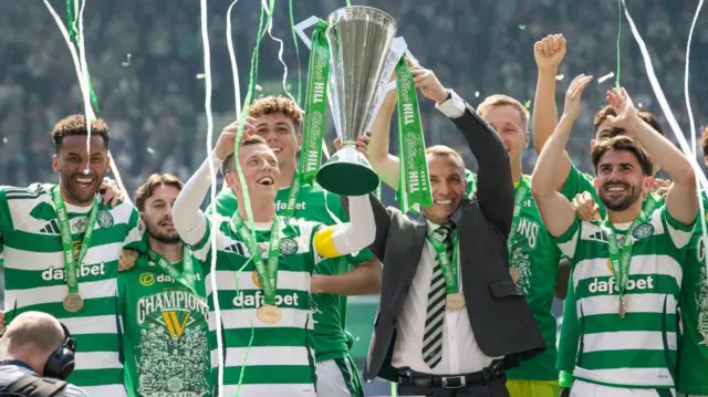 Celtic celebrate with the Scottish Premiership trophy