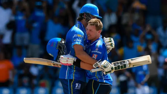 Tim Seifert celebrates his century