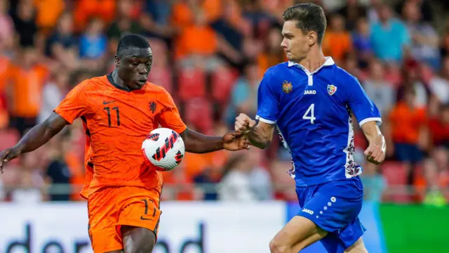 Brian Brobbey of the Netherlands Ubder-21 and Iurie Iovu of Moldova Under-21 